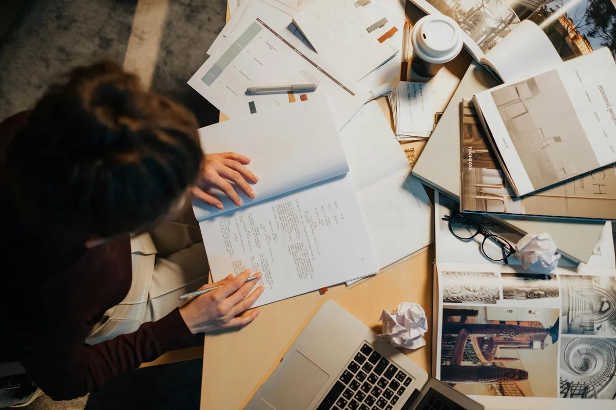 A dissertation planning desk with outline notes